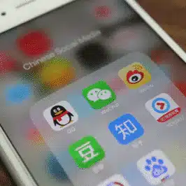 Chinese social media icons on a smart phone screen